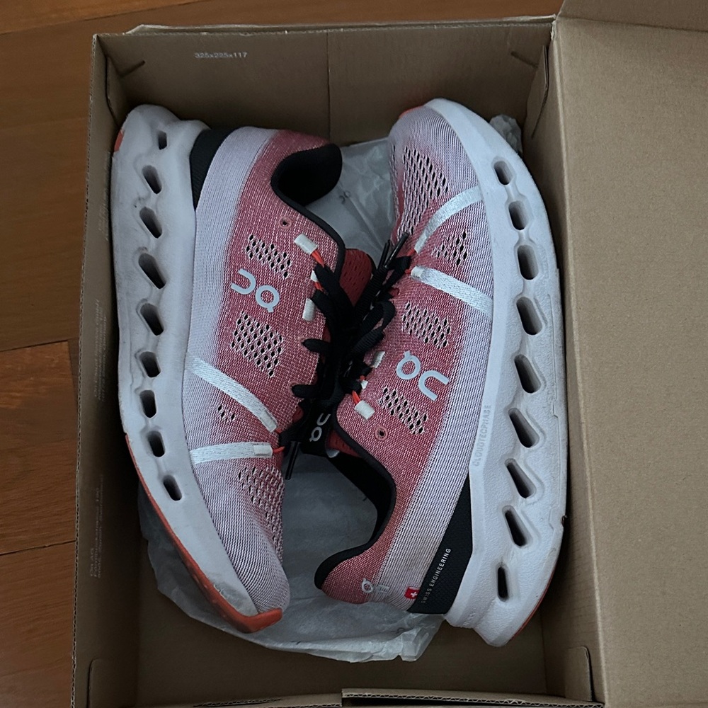 On Running Coral and White Athletic Shoes